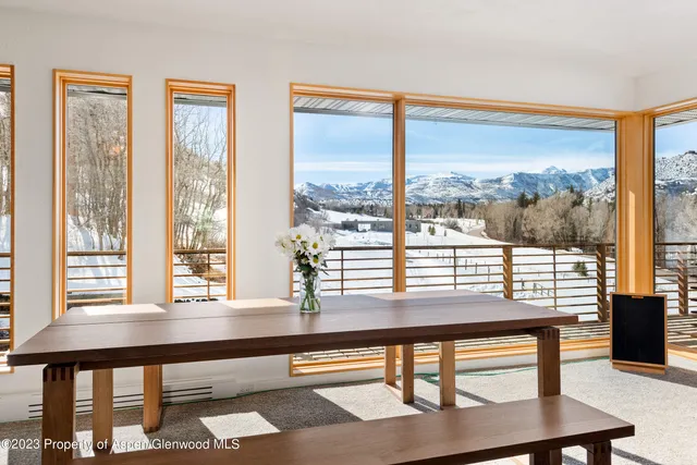 a bedroom with furniture and a rug