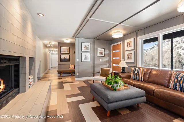 a bathroom with a sink shower and a mirror