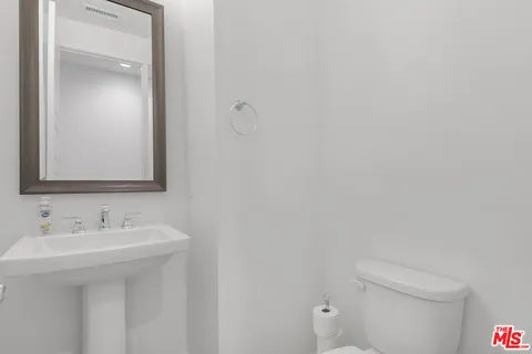 a bathroom with a sink and mirror