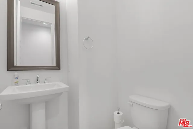 a bathroom with a sink and mirror