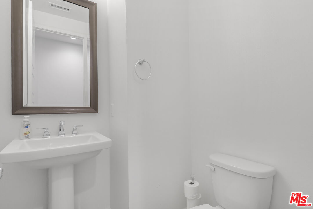 73500 Henri Drive Palm Desert, CA 92211 - Photo 23 of 28 a bathroom with a sink and mirror