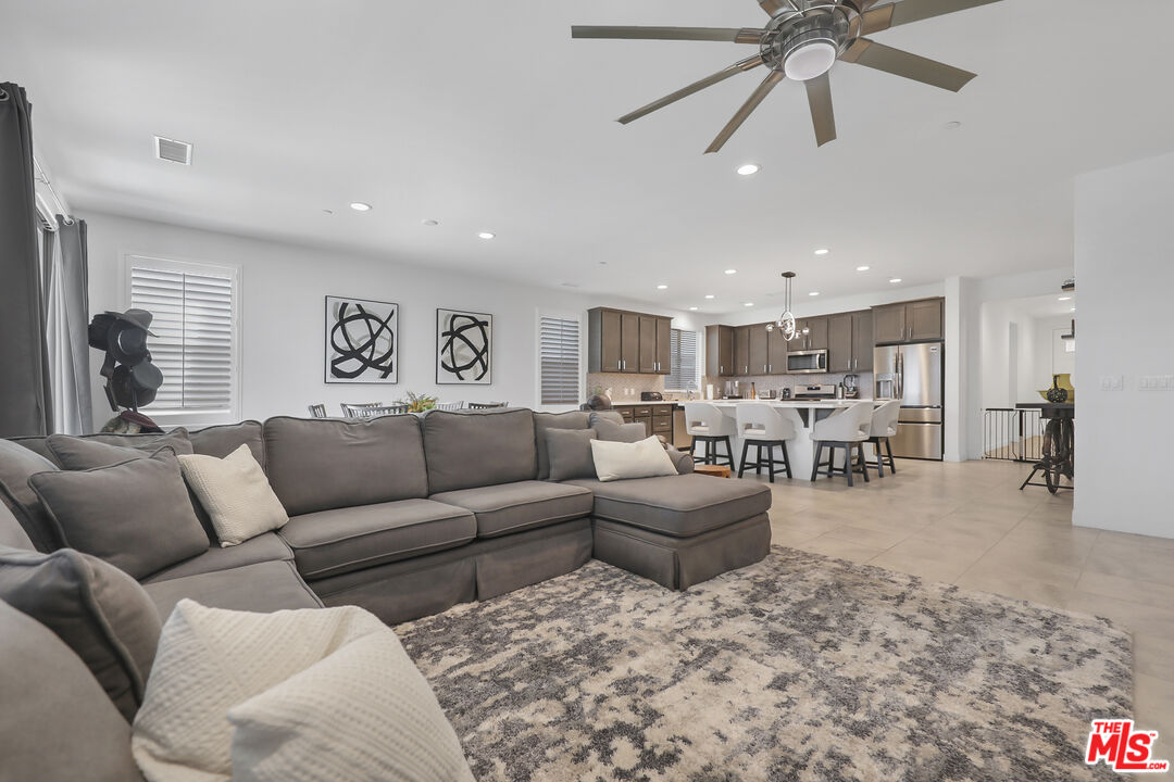 73500 Henri Drive Palm Desert, CA 92211 - Photo 5 of 28 a living room with furniture and kitchen view