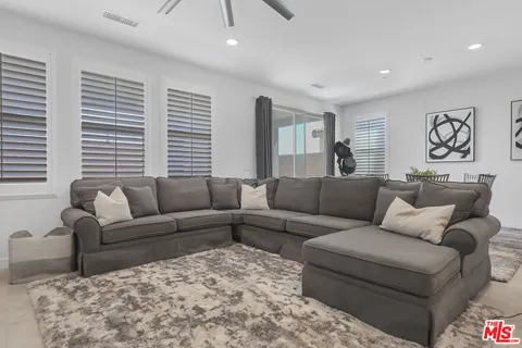 a living room with a couch and a window