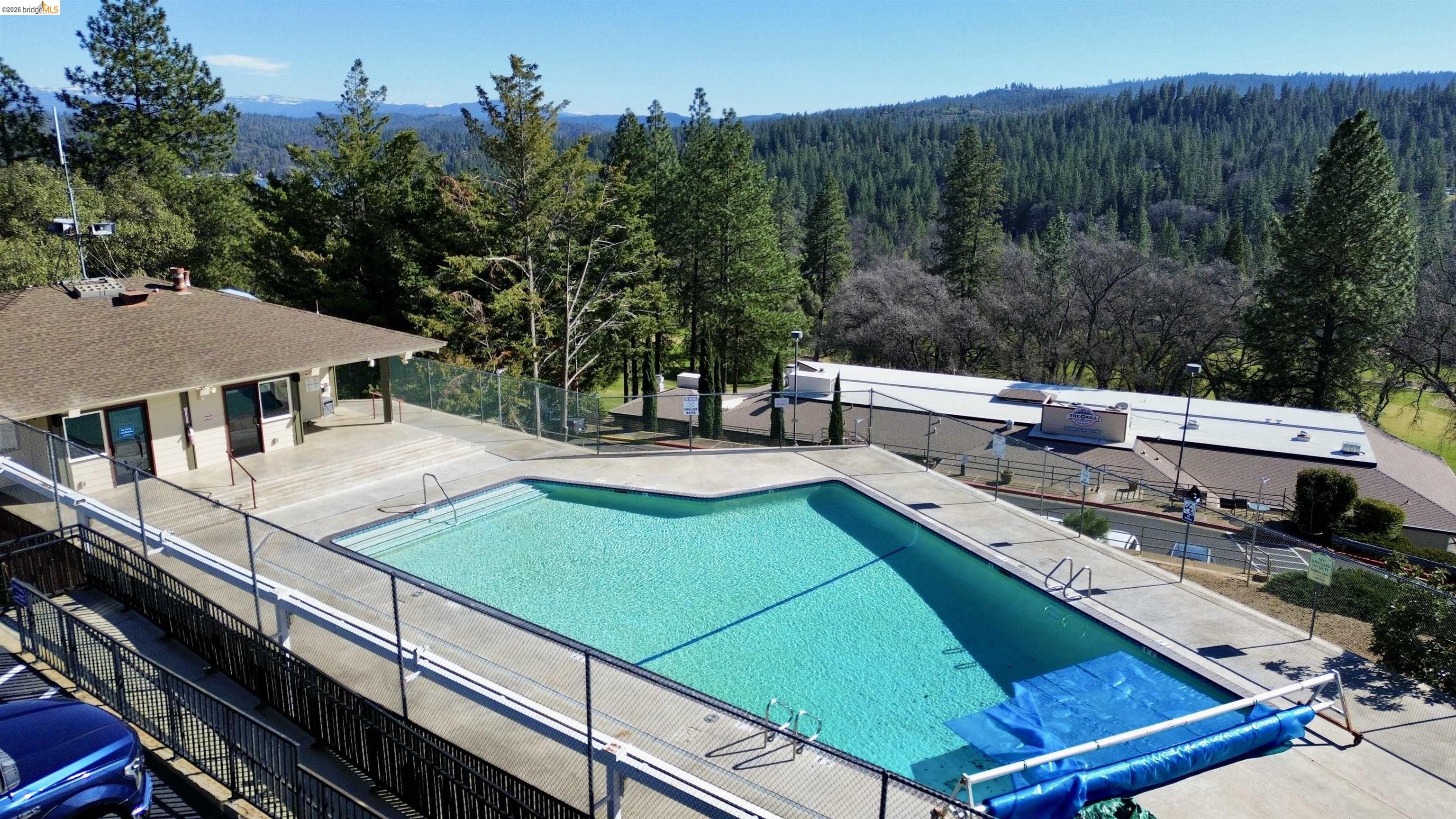 13033 Clements Road Groveland, CA 95321 - Photo 21 of 23 Community pool with a patio area and a view of trees