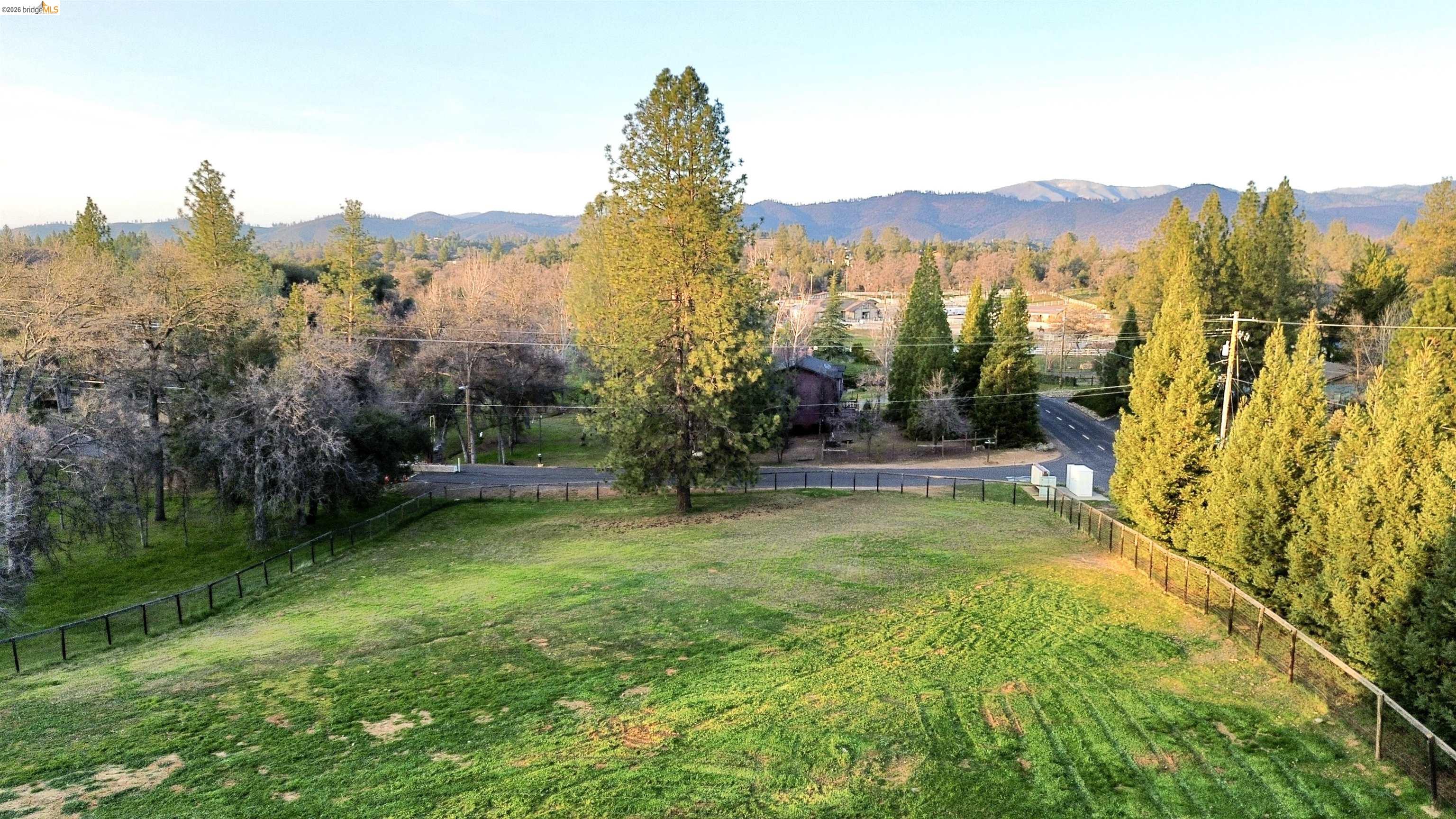 13033 Clements Road Groveland, CA 95321 - Photo 3 of 23 View of pasture with watering ports featuring a mountain view