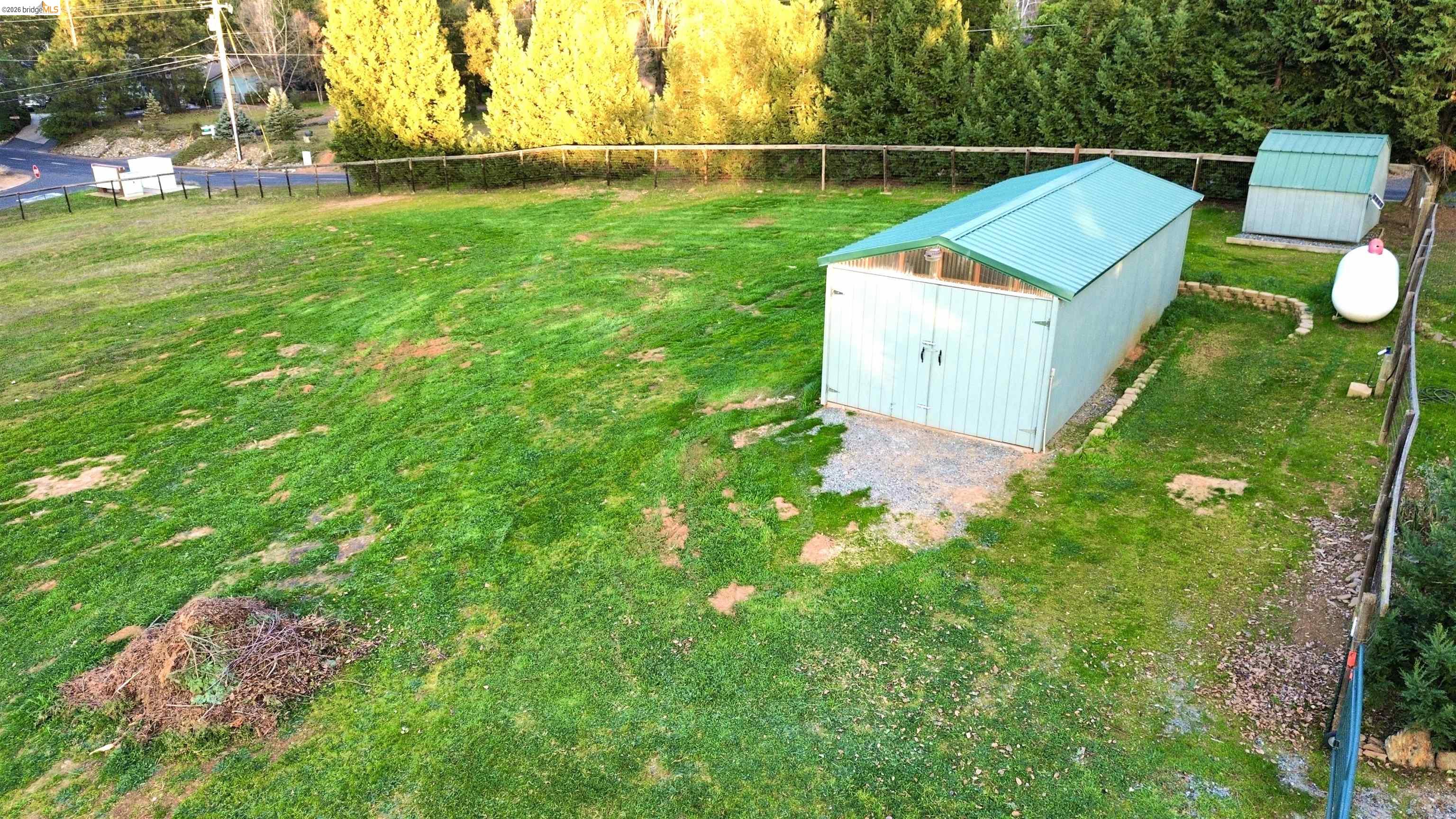 13033 Clements Road Groveland, CA 95321 - Photo 5 of 23 View of yard featuring two outdoor structures.