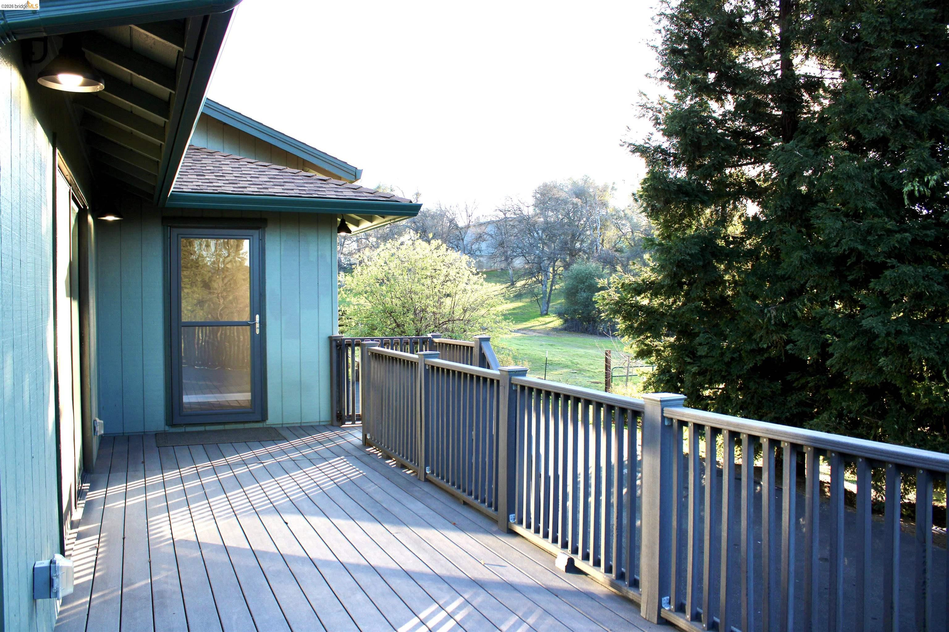 13033 Clements Road Groveland, CA 95321 - Photo 9 of 23 Partial view of deck leading to front door