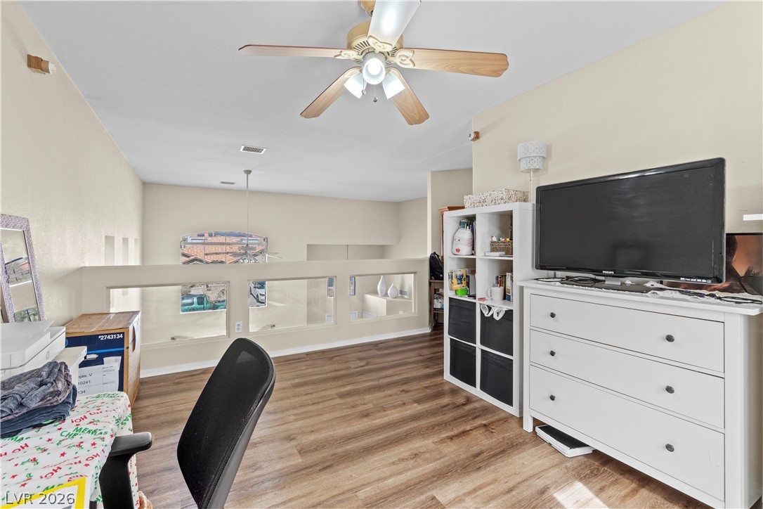 1419 Red Sunset Avenue Henderson, NV 89074 - Photo 16 of 35 Office space with a ceiling fan and light wood finished floors