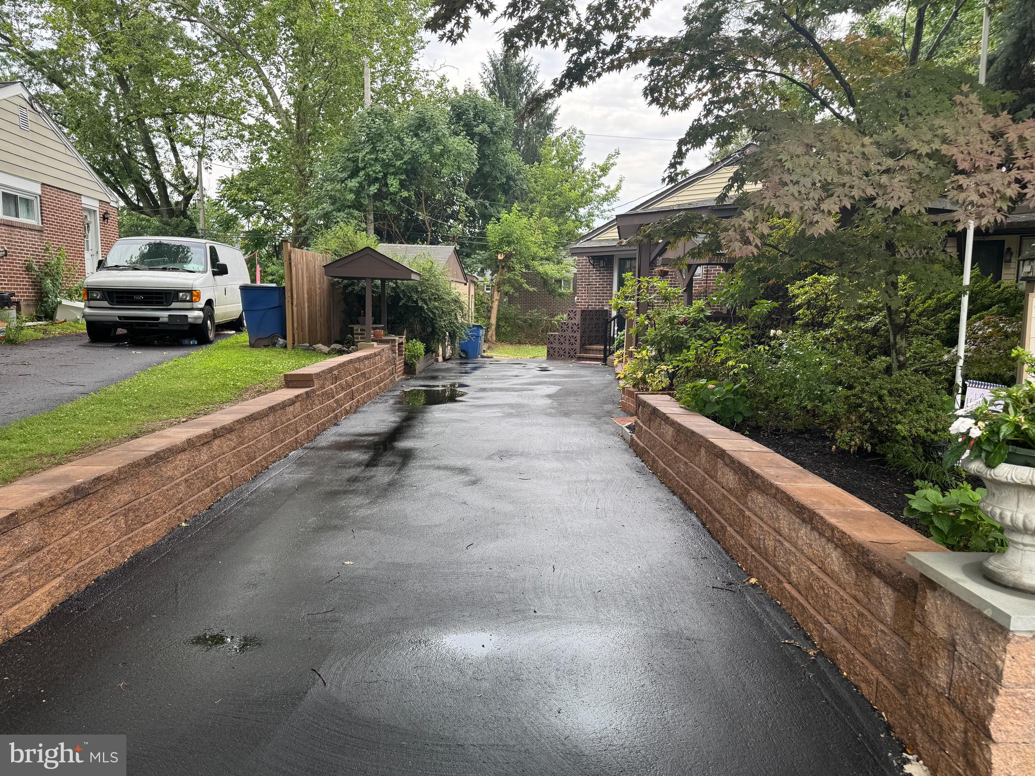 2181 Springhouse Lane Aston, PA 19014 - Photo 4 of 6 Driveway with retaining walls