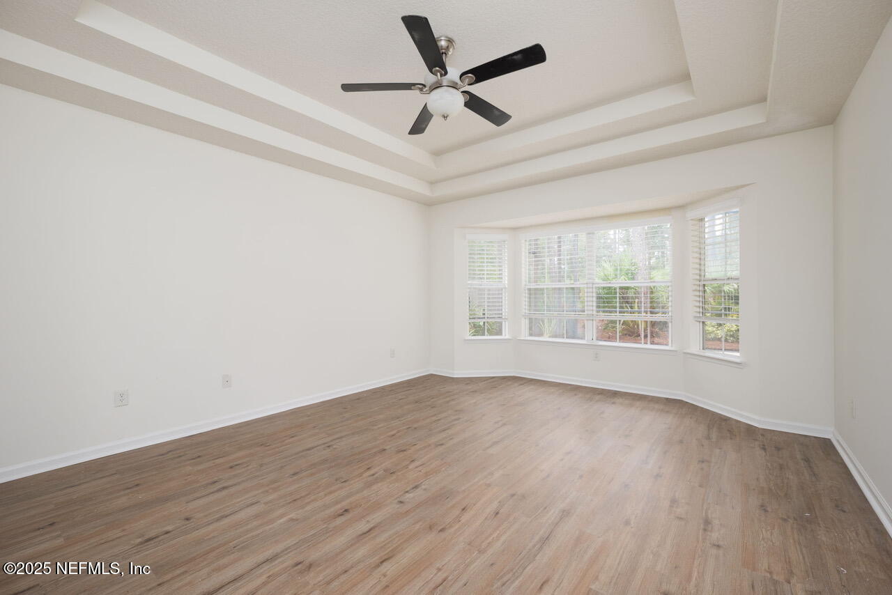 1140 Eddystone Lane Ponte Vedra, FL 32081 - Photo 13 of 29 an empty room with wooden floor and windows