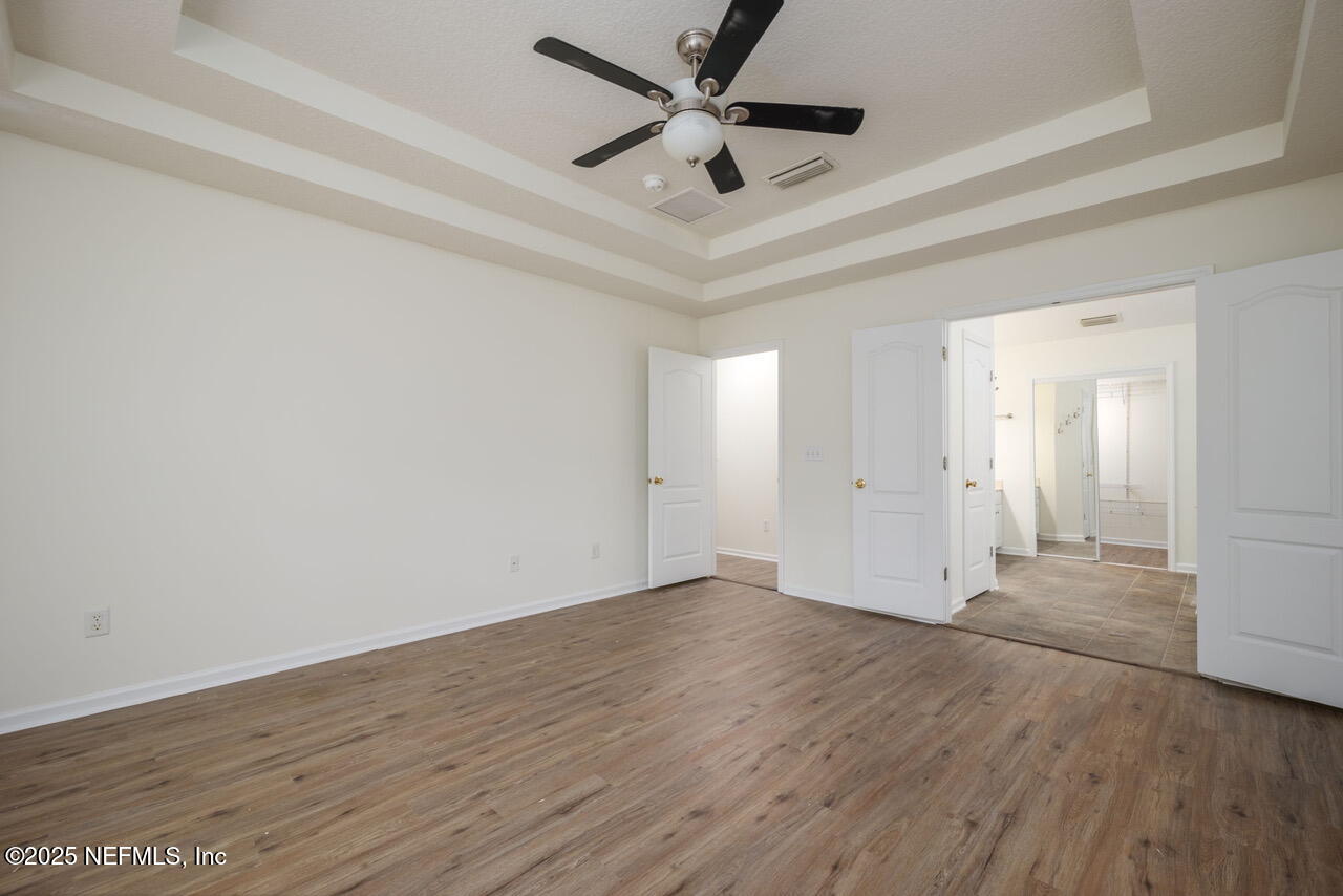 1140 Eddystone Lane Ponte Vedra, FL 32081 - Photo 14 of 29 an empty room with wooden floor and ceiling fan