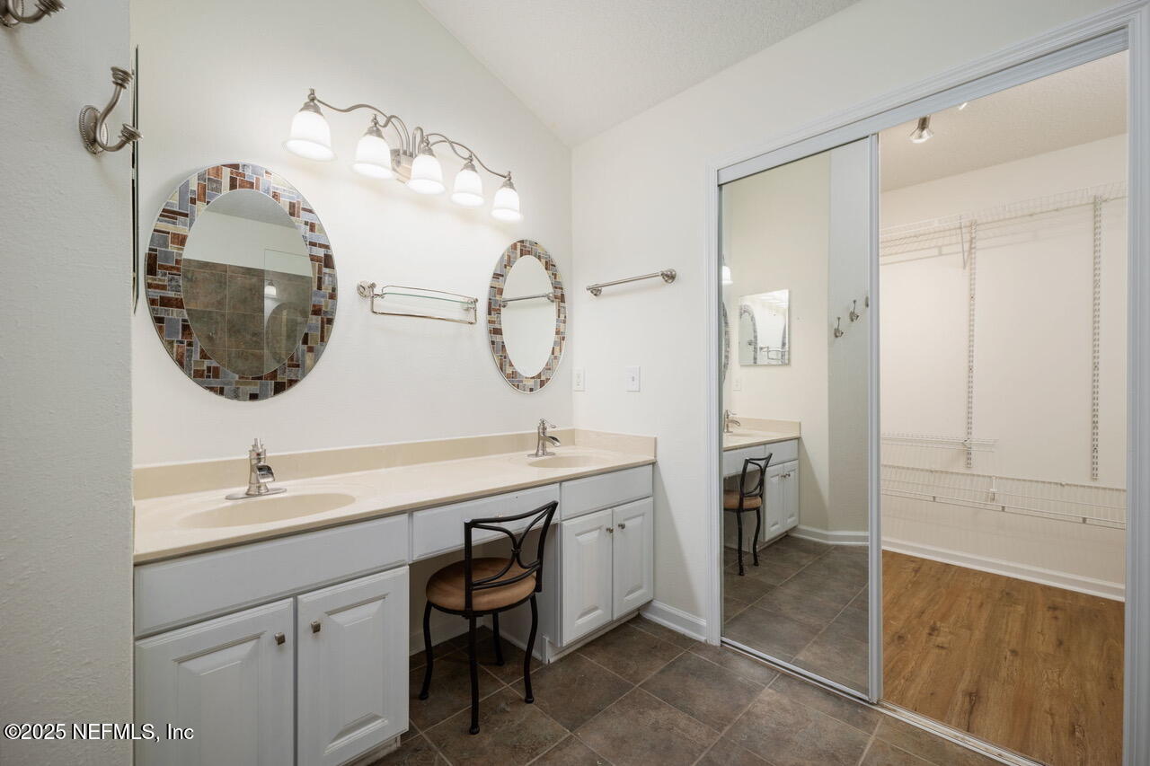 1140 Eddystone Lane Ponte Vedra, FL 32081 - Photo 17 of 29 a bathroom with a double vanity sink and a mirror
