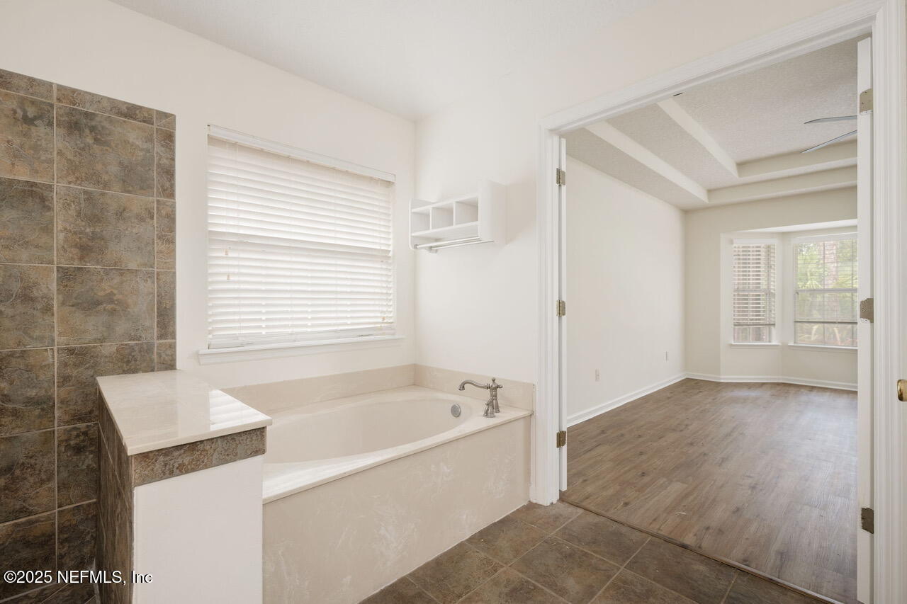 1140 Eddystone Lane Ponte Vedra, FL 32081 - Photo 18 of 29 a bathroom with a bathtub and shower