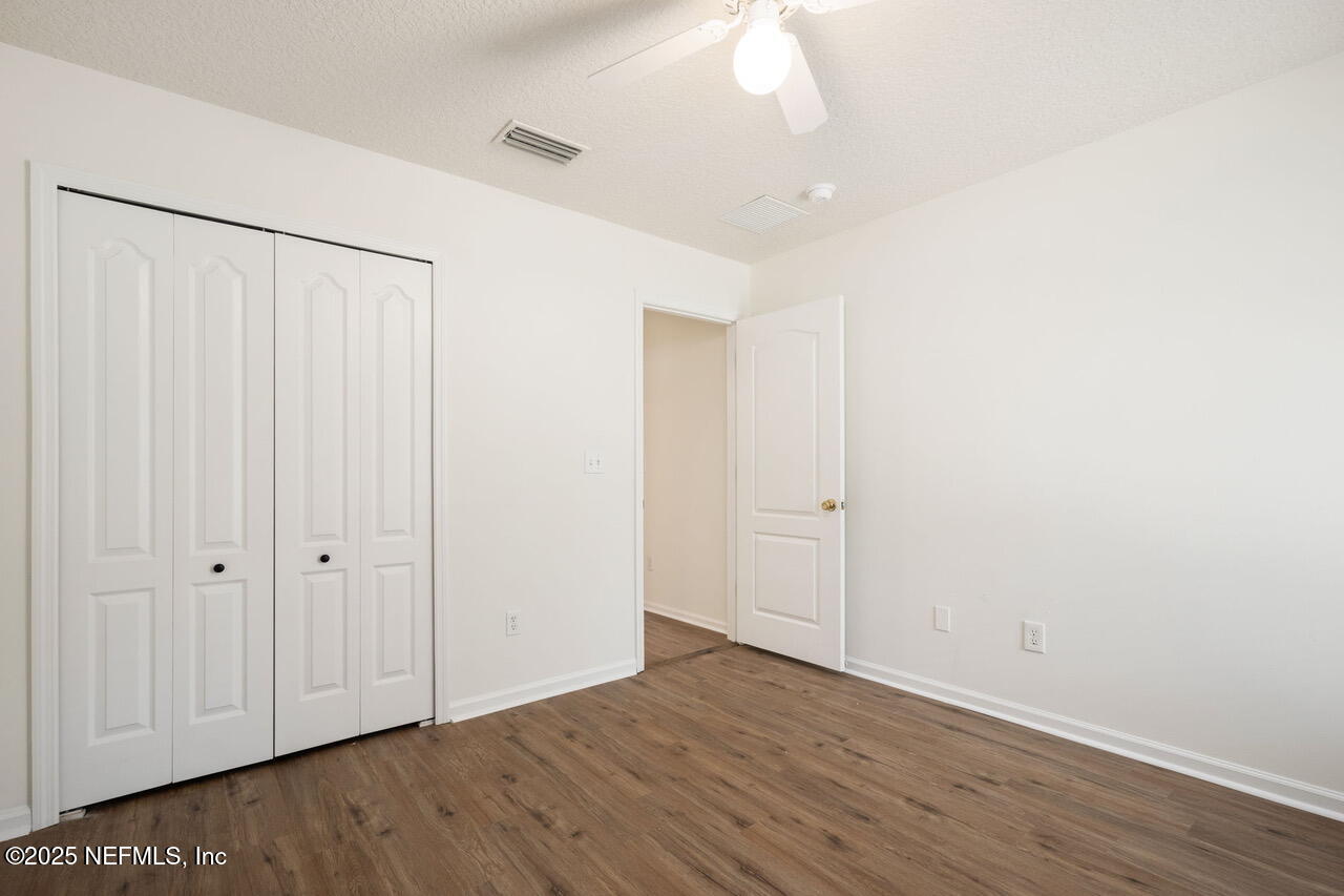 1140 Eddystone Lane Ponte Vedra, FL 32081 - Photo 20 of 29 a view of an empty room with wooden floor