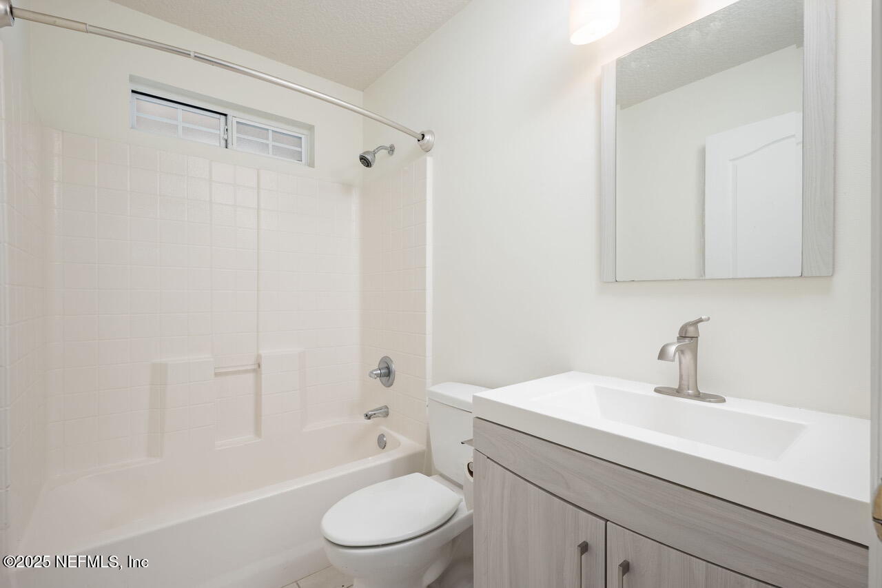 1140 Eddystone Lane Ponte Vedra, FL 32081 - Photo 21 of 29 a bathroom with a sink a toilet and shower