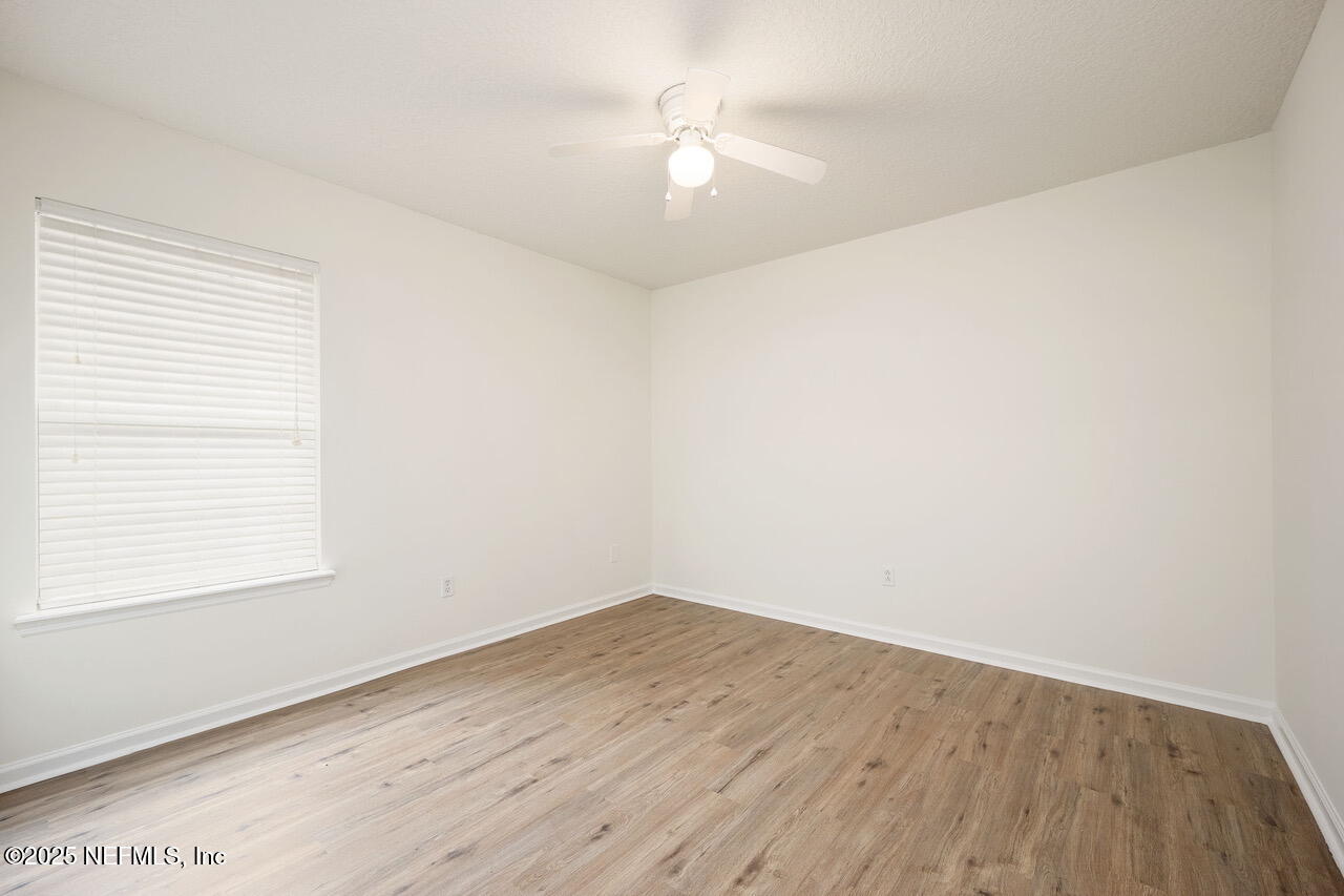 1140 Eddystone Lane Ponte Vedra, FL 32081 - Photo 22 of 29 an empty room with a window and a ceiling fan