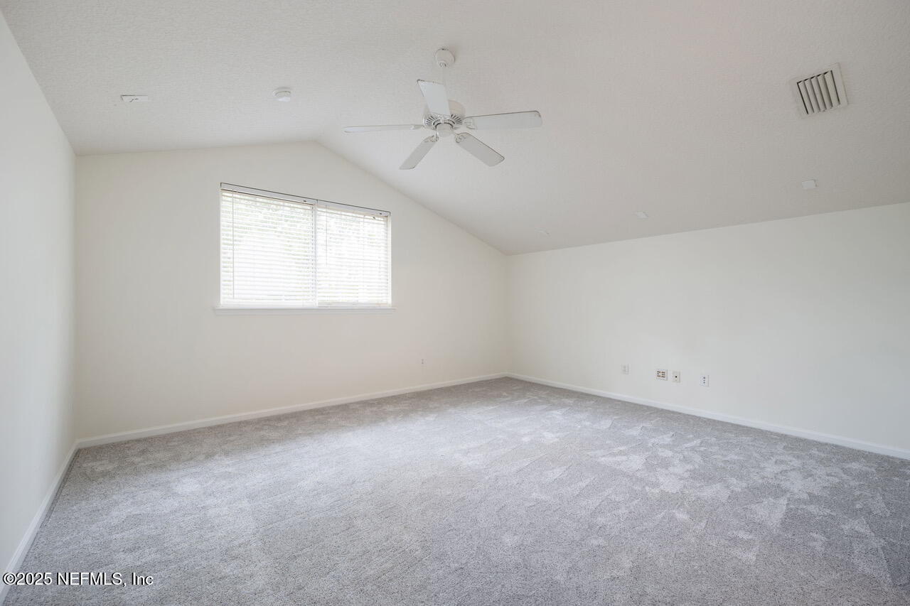 1140 Eddystone Lane Ponte Vedra, FL 32081 - Photo 24 of 29 an empty room with a window and a ceiling fan