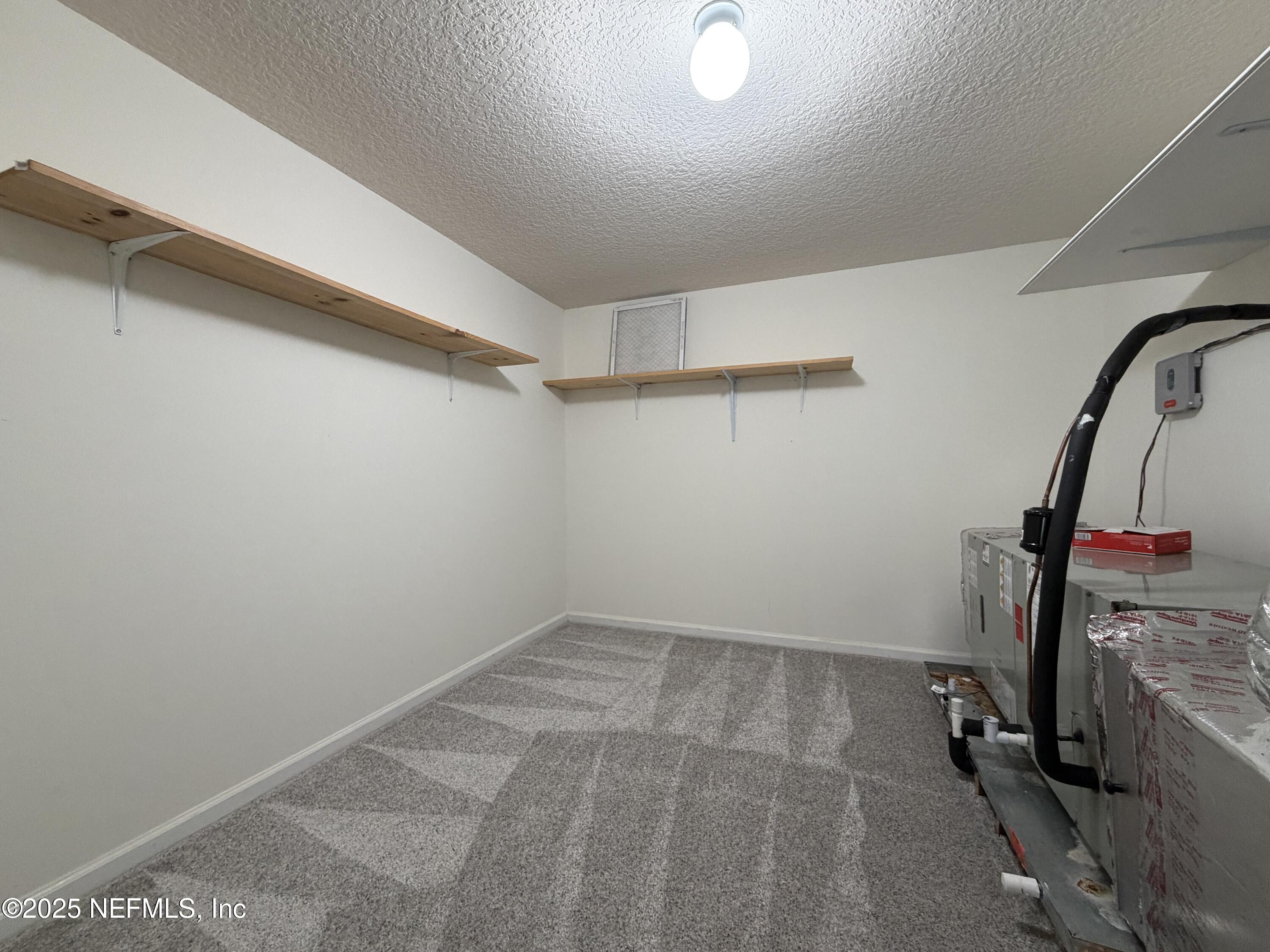 1140 Eddystone Lane Ponte Vedra, FL 32081 - Photo 27 of 29 a view of storage and utility room with washer and dryer