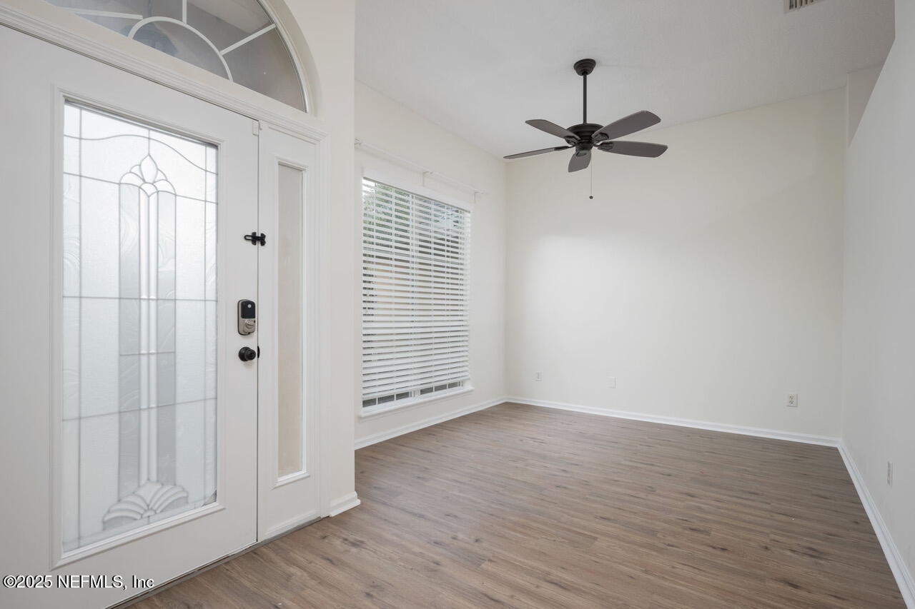 1140 Eddystone Lane Ponte Vedra, FL 32081 - Photo 6 of 29 wooden floor in an empty room with a window