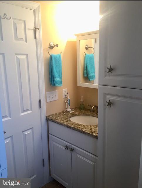 110 West Amberjack Way Lavallette, NJ 08735 - Photo 10 of 12 a bathroom with a granite countertop sink and a mirror