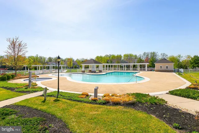 a view of a swimming pool with an ocean view