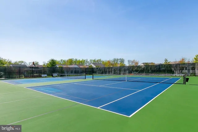 a view of an outdoor space and tennis court
