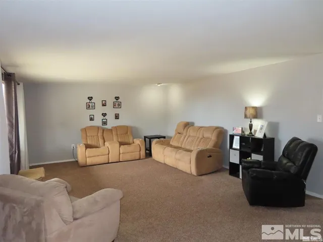 a kitchen with a sink a stove and chairs
