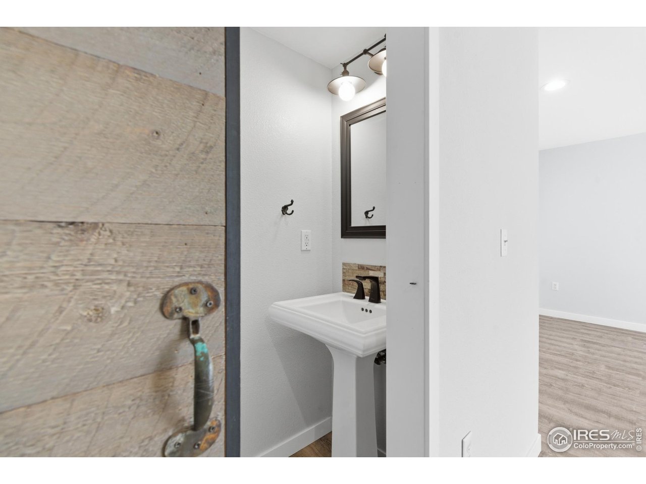 357 Albion Way, Unit 4 Fort Collins, CO 80526 - Photo 14 of 28 a bathroom with a sink and a mirror