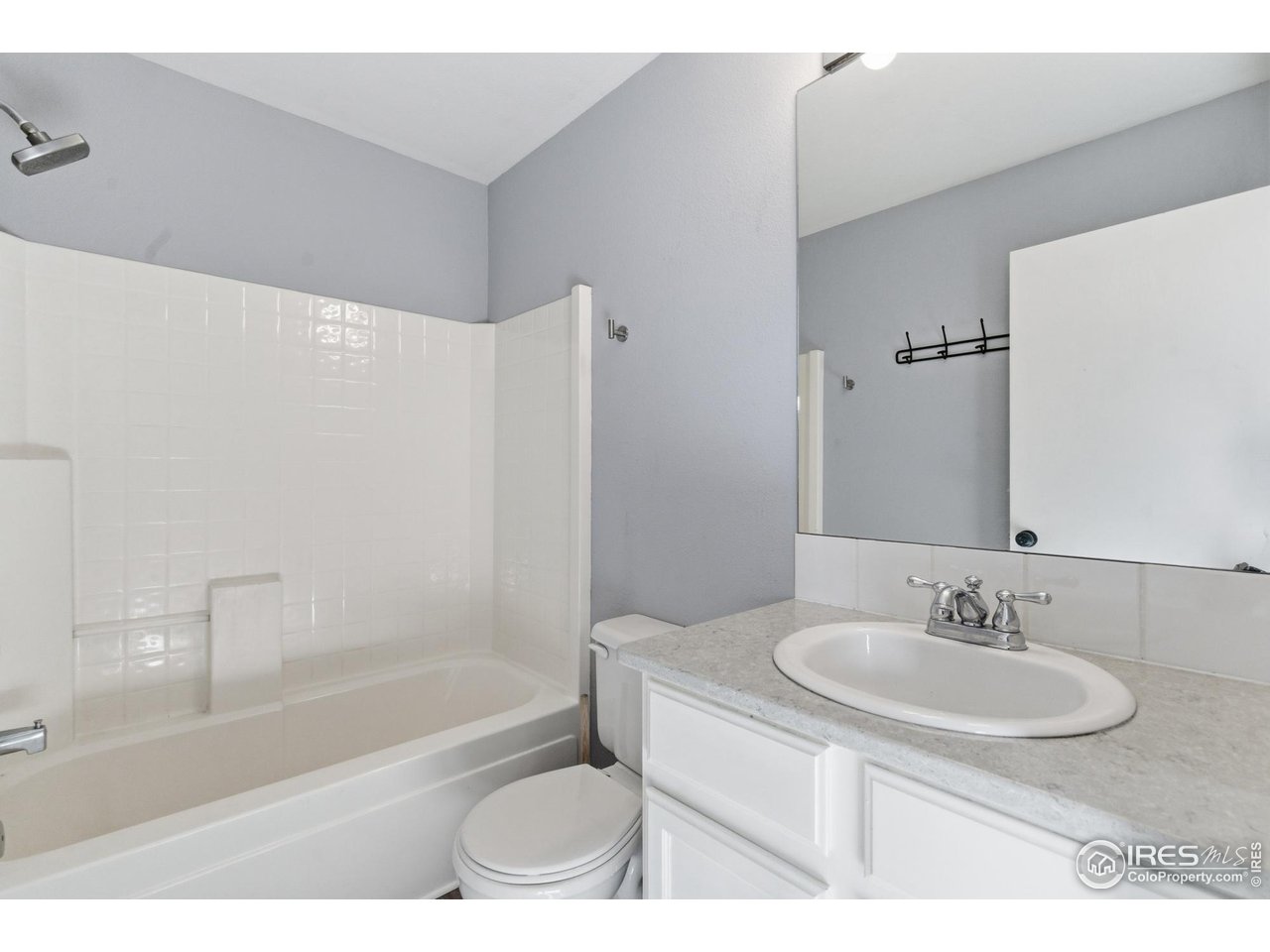 357 Albion Way, Unit 4 Fort Collins, CO 80526 - Photo 20 of 28 a bathroom with a sink and a mirror