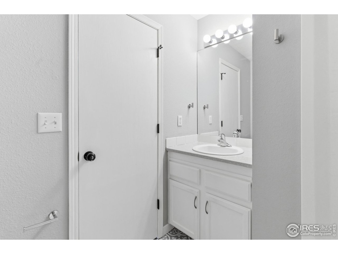 357 Albion Way, Unit 4 Fort Collins, CO 80526 - Photo 21 of 28 a bathroom with a sink and a mirror