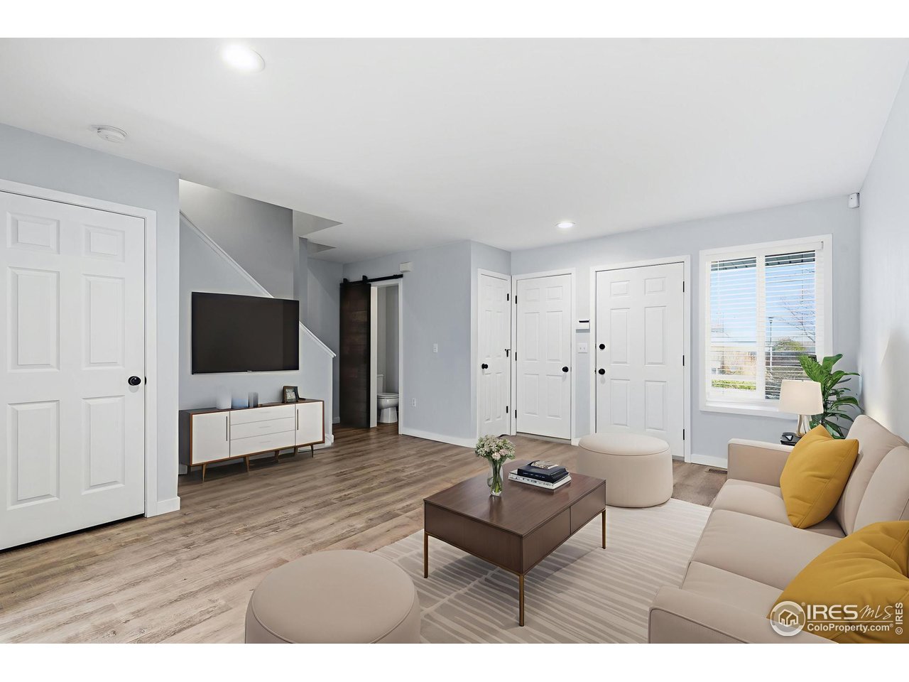 357 Albion Way, Unit 4 Fort Collins, CO 80526 - Photo 7 of 28 a living room with furniture and a flat screen tv