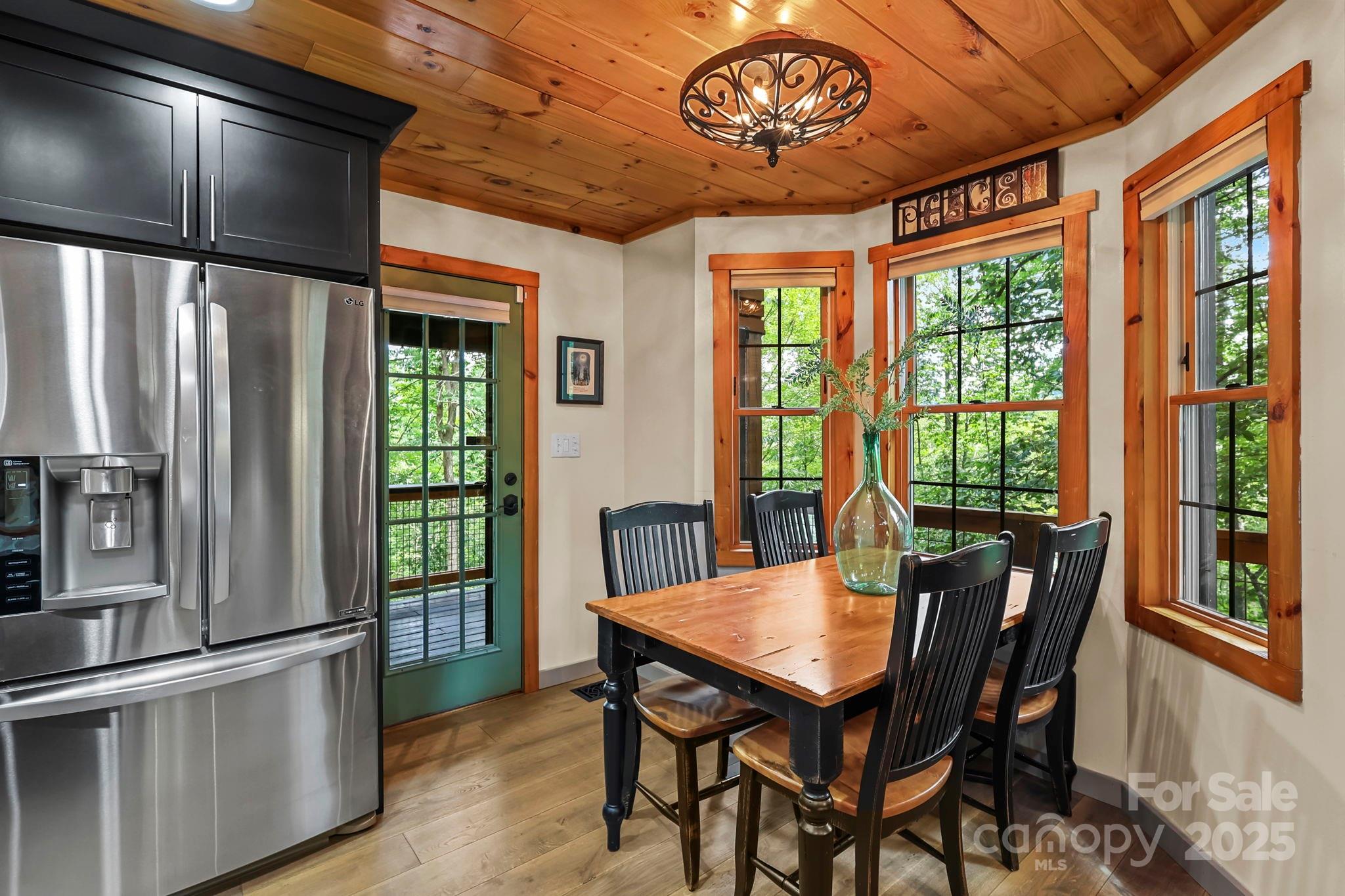 228 Woodby Ridge Road Vilas, NC 28692 - Photo 12 of 46 a view of a dining room with furniture window and outside view