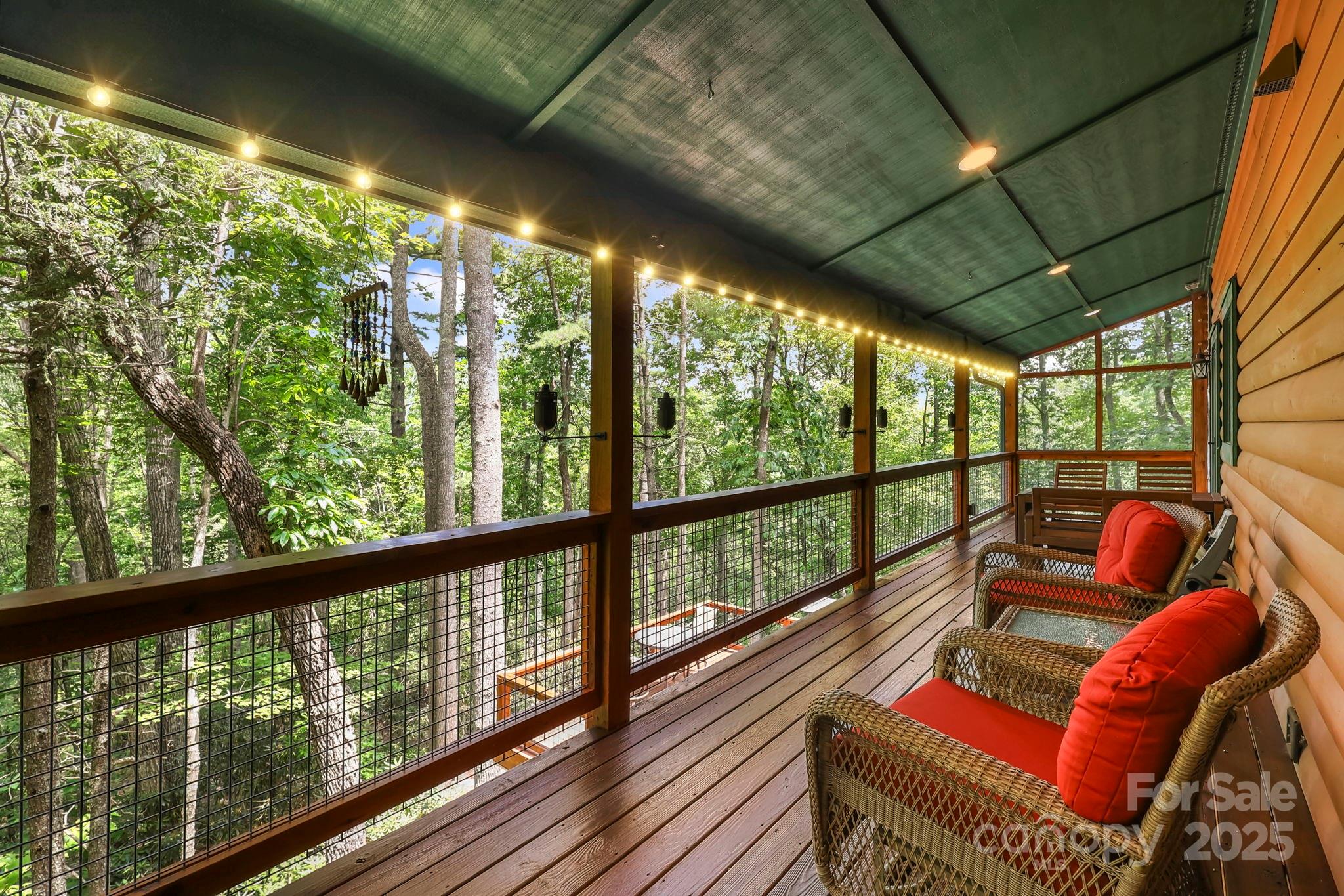 228 Woodby Ridge Road Vilas, NC 28692 - Photo 13 of 46 a view of a city from a balcony with furniture