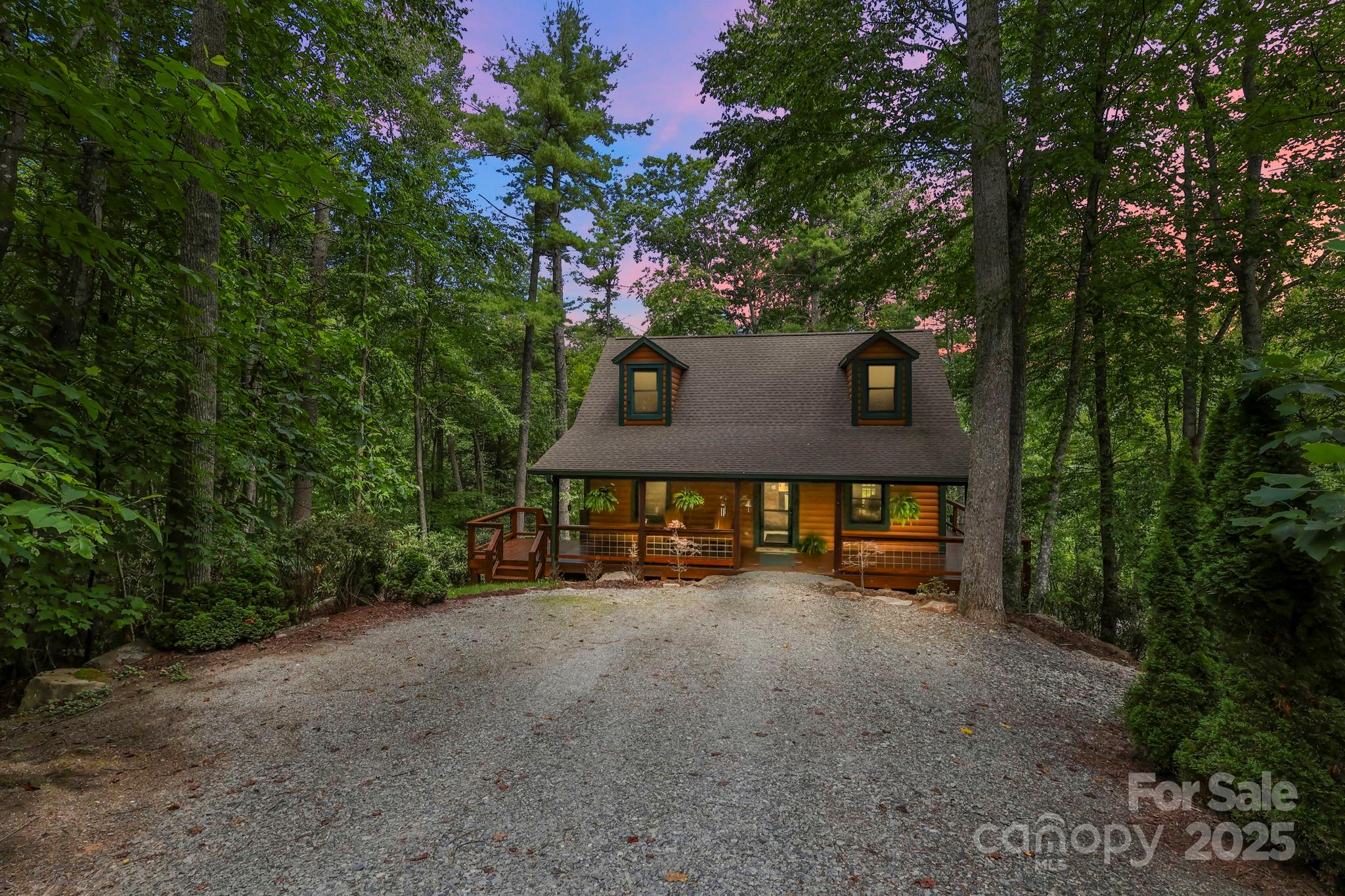 228 Woodby Ridge Road Vilas, NC 28692 - Photo 2 of 46 a front view of a house with a tree