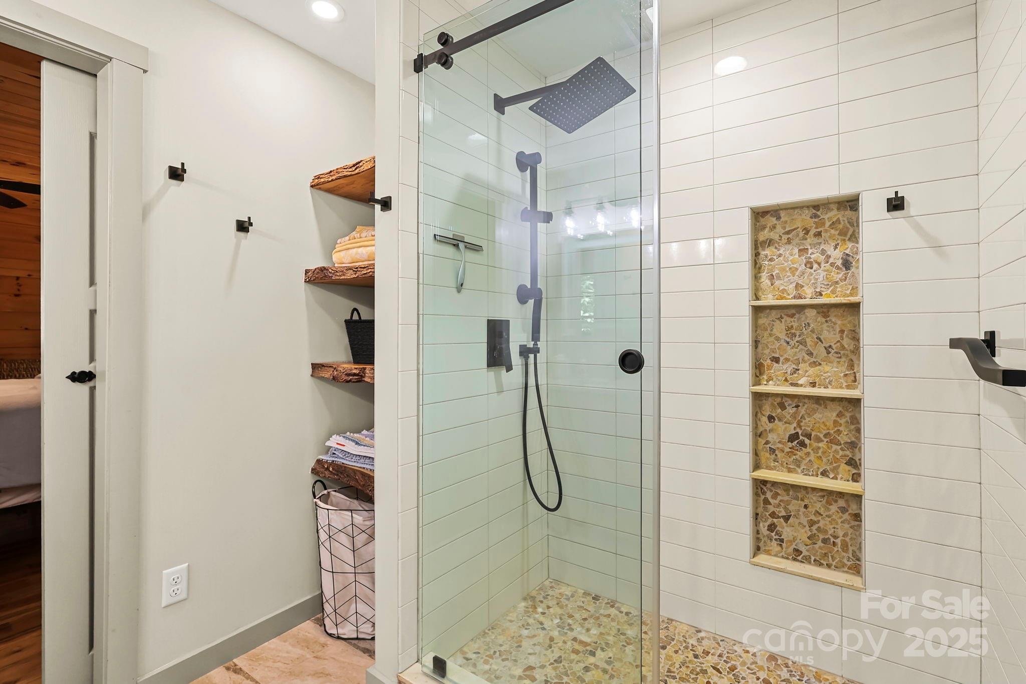 228 Woodby Ridge Road Vilas, NC 28692 - Photo 22 of 46 a bathroom with a shower and a sink