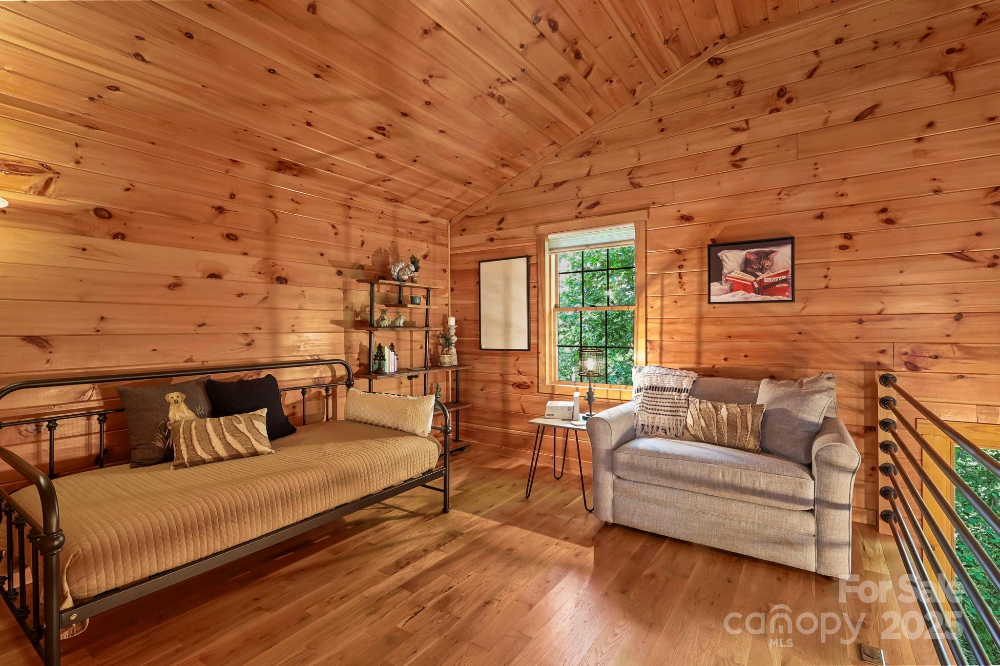 228 Woodby Ridge Road Vilas, NC 28692 - Photo 24 of 46 a living room with furniture and wooden floor