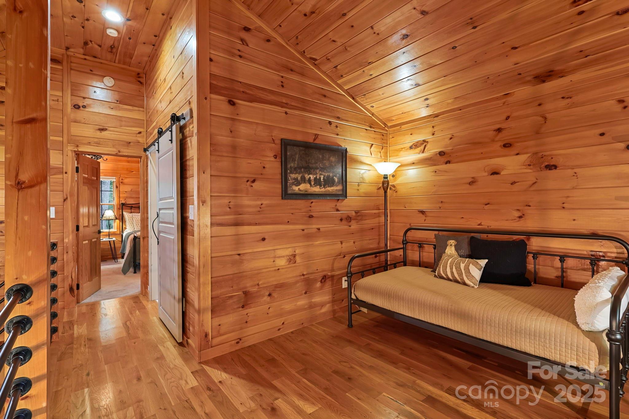 228 Woodby Ridge Road Vilas, NC 28692 - Photo 26 of 46 a bedroom with a bed and a dresser