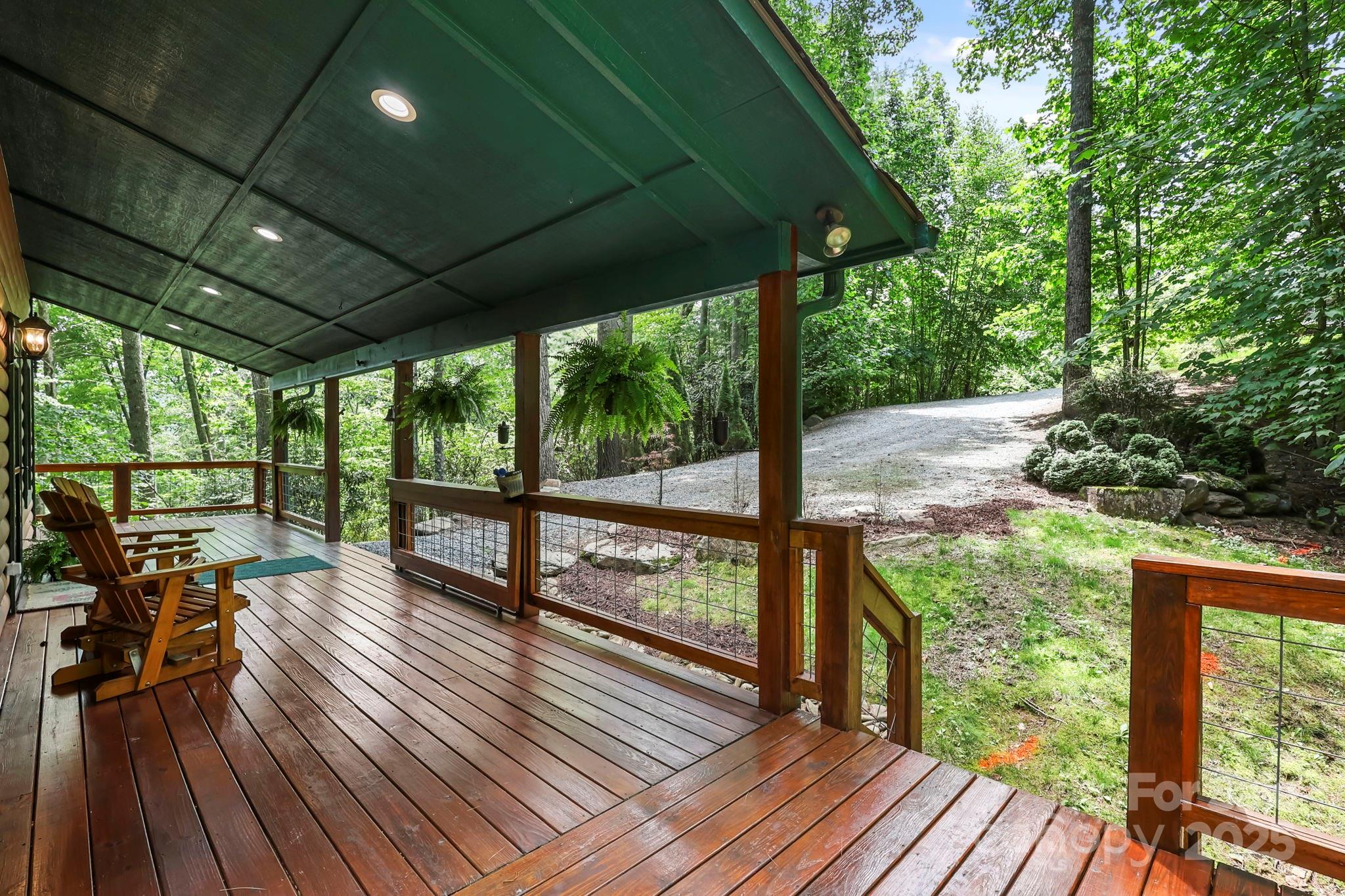 228 Woodby Ridge Road Vilas, NC 28692 - Photo 3 of 46 a view of balcony with wooden floor