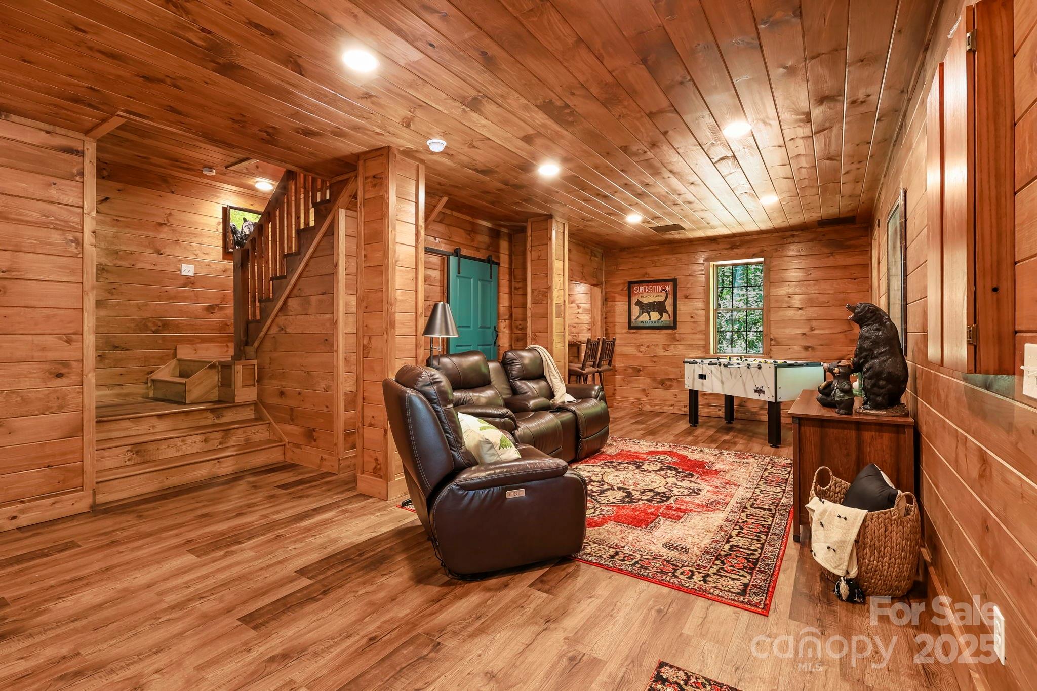 228 Woodby Ridge Road Vilas, NC 28692 - Photo 36 of 46 a living room with furniture and wooden floor