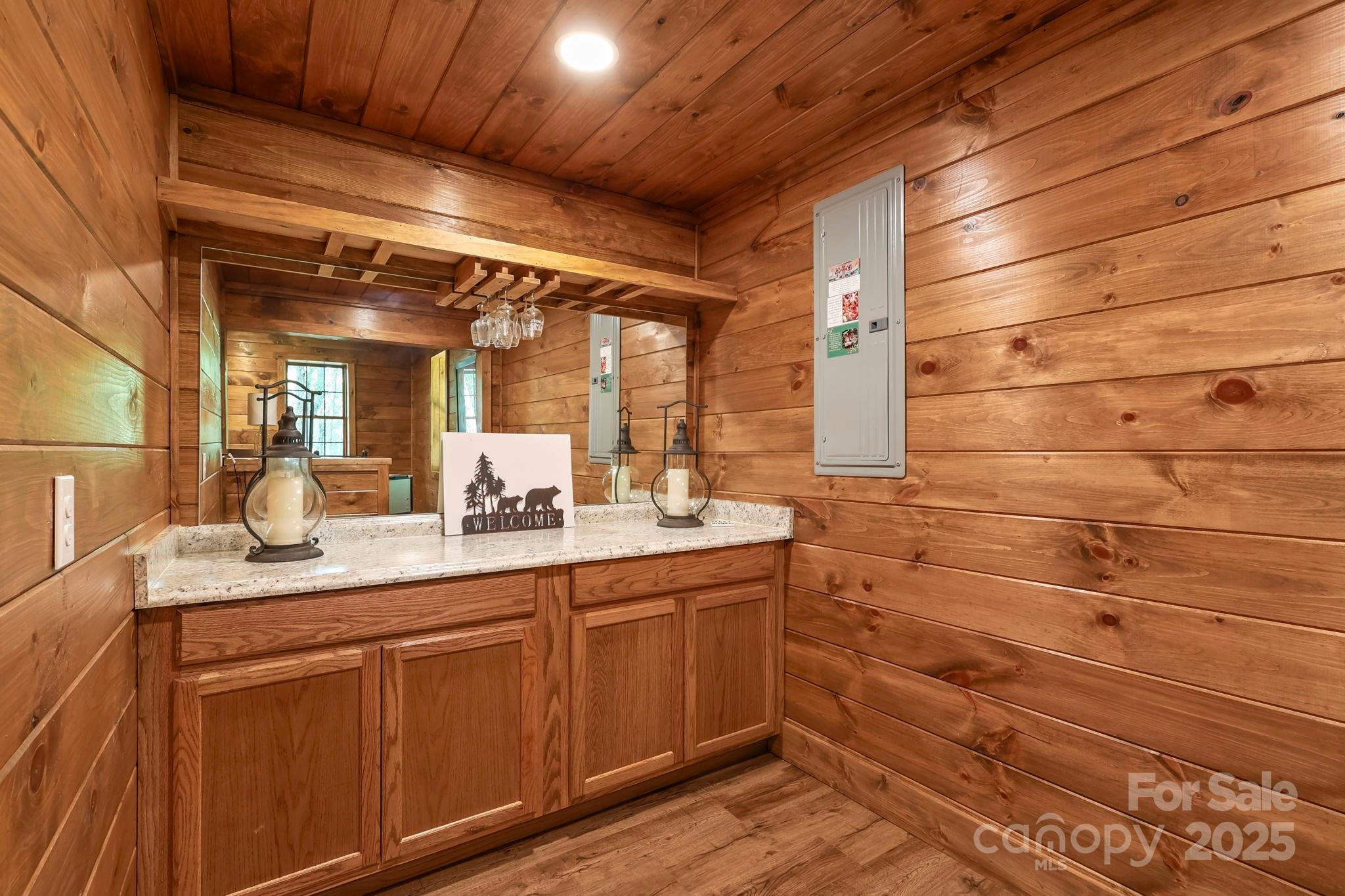 228 Woodby Ridge Road Vilas, NC 28692 - Photo 39 of 46 a bathroom with a sink and a mirror