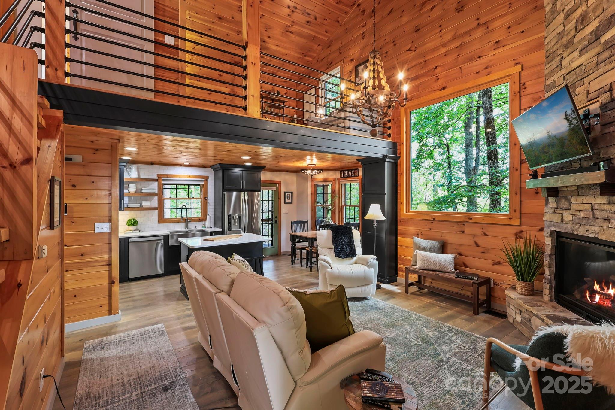 228 Woodby Ridge Road Vilas, NC 28692 - Photo 4 of 46 a outdoor living space with patio furniture and fireplace