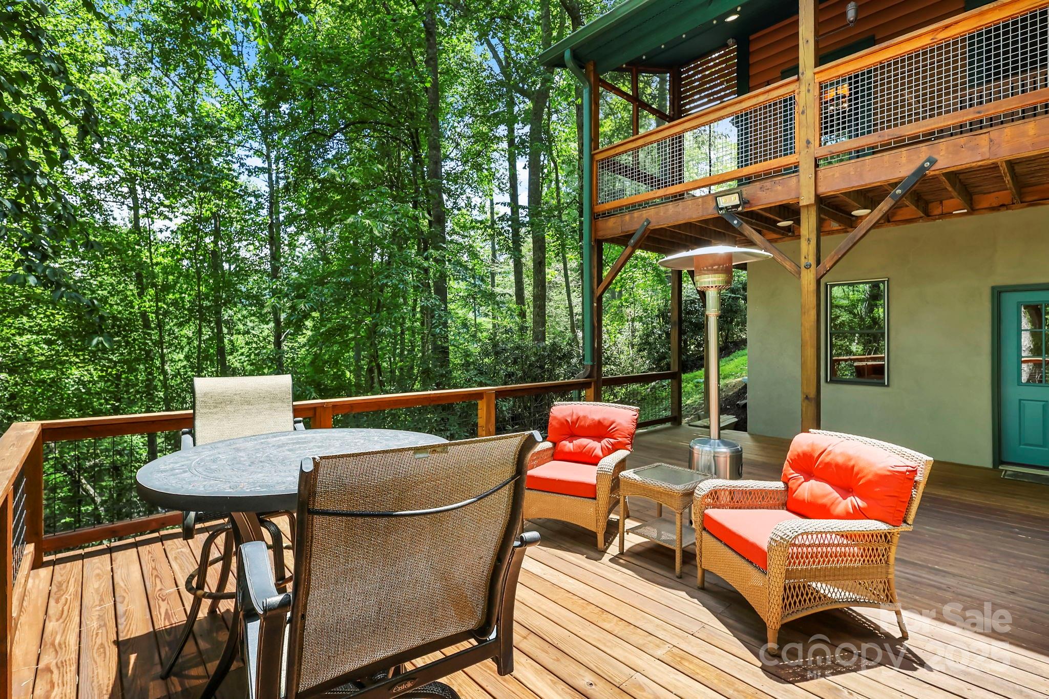 228 Woodby Ridge Road Vilas, NC 28692 - Photo 41 of 46 a outdoor sitting area with furniture and wooden floor