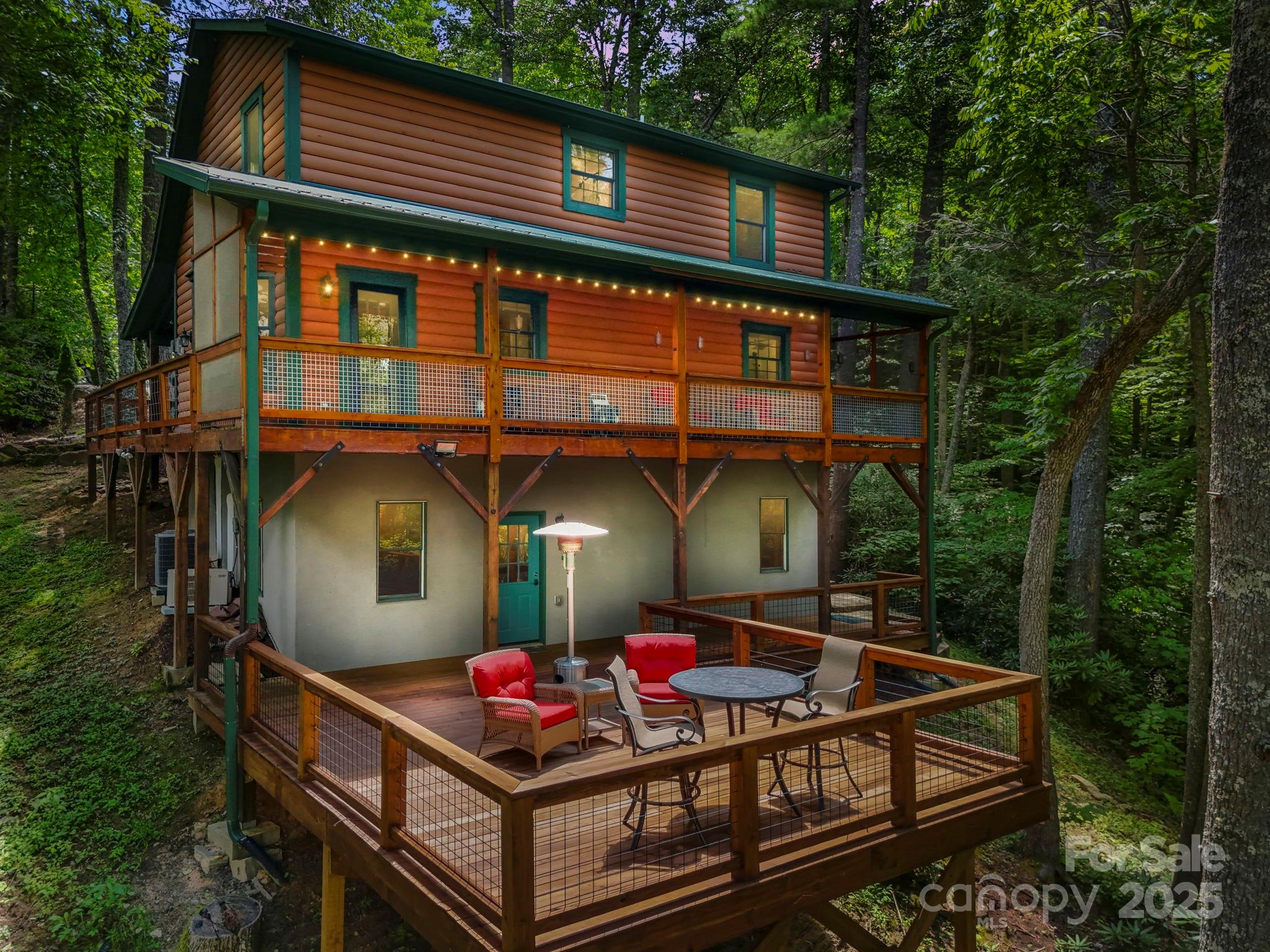 228 Woodby Ridge Road Vilas, NC 28692 - Photo 46 of 46 a backyard of a house with seating space