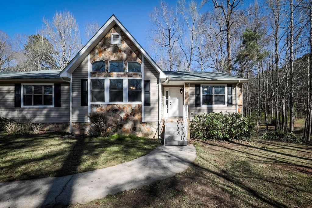 1210 Park Pl Drive Jonesboro, GA 30236 - Photo 1 of 1 a front view of a house with a yard