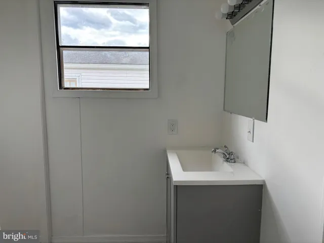 a bathroom with a toilet and a bathtub