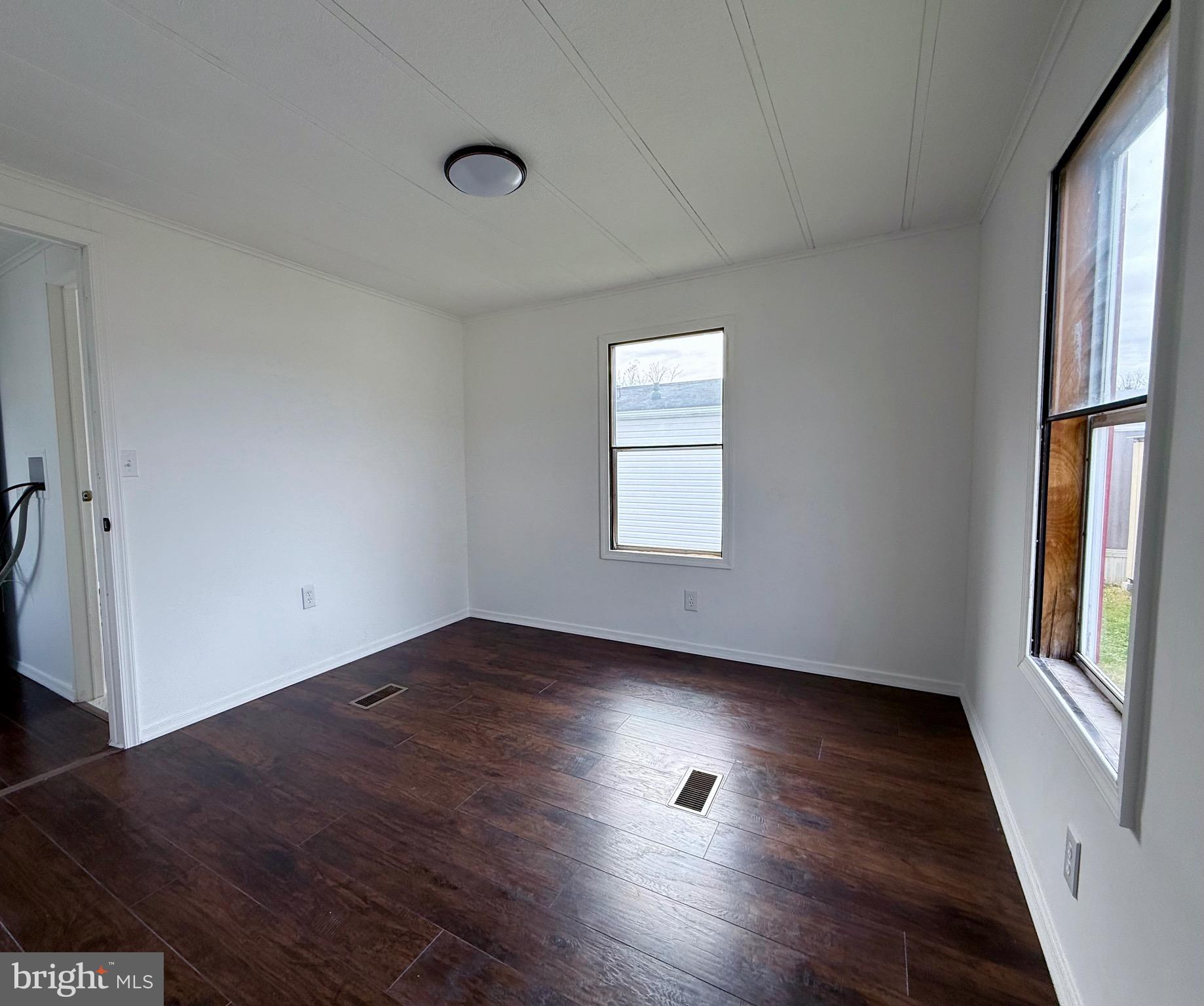 865 Cypress Ave Spring Spring City, PA 19475 - Photo 25 of 33 an empty room with wooden floor and windows