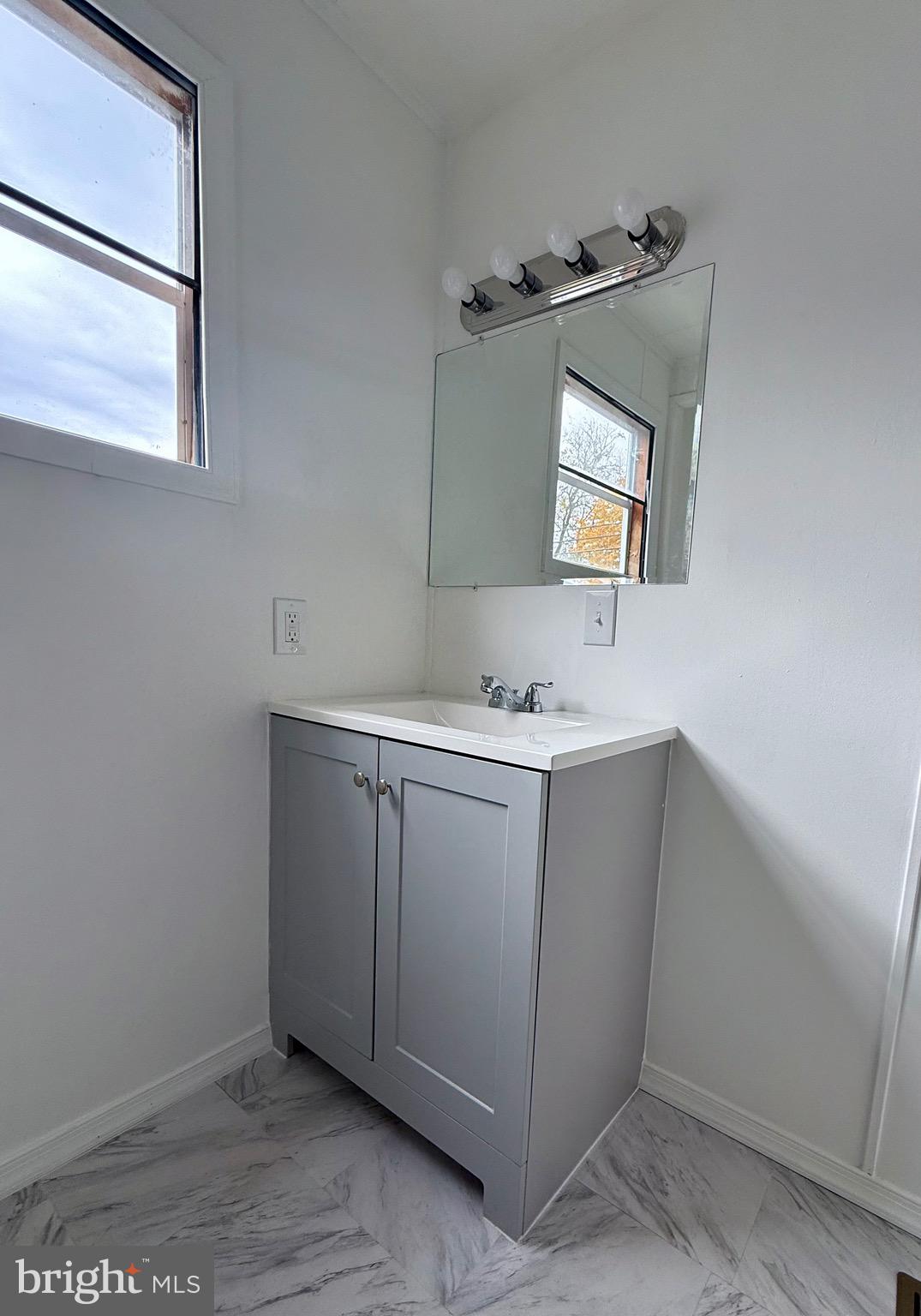 865 Cypress Ave Spring Spring City, PA 19475 - Photo 26 of 33 a bathroom with a sink and a mirror