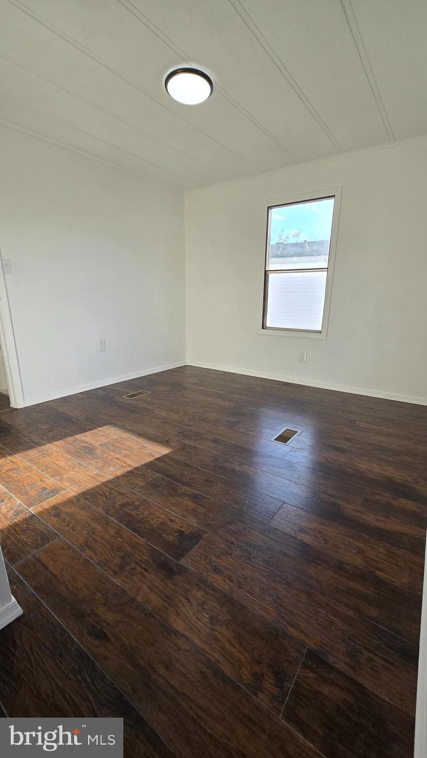 865 Cypress Ave Spring Spring City, PA 19475 - Photo 28 of 33 an empty room with wooden floor and windows