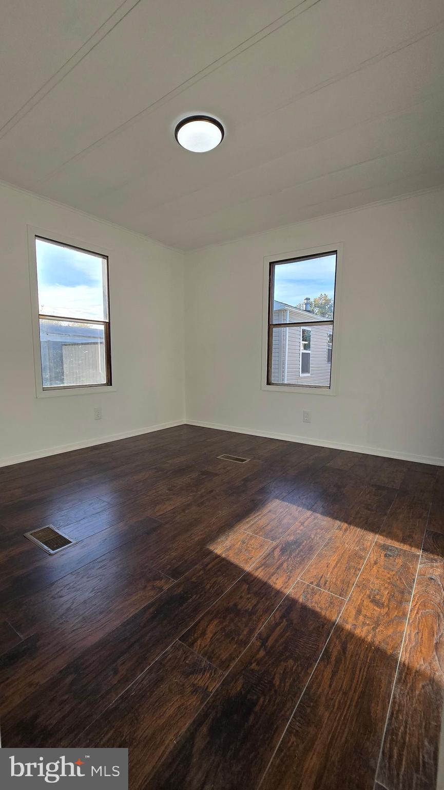 865 Cypress Ave Spring Spring City, PA 19475 - Photo 29 of 33 a view of a room with wooden floor and window