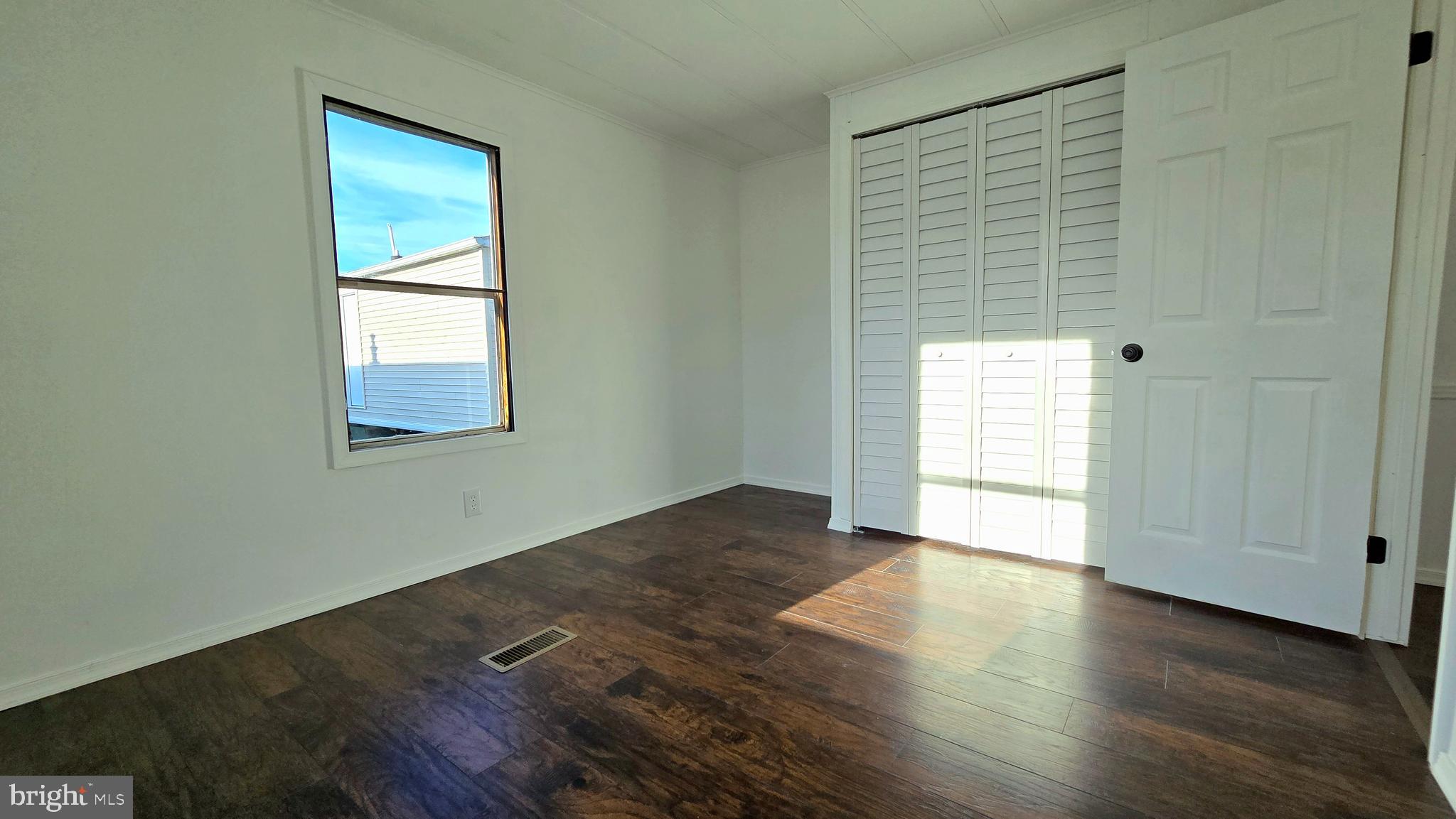865 Cypress Ave Spring Spring City, PA 19475 - Photo 10 of 33 an empty room with wooden floor and windows